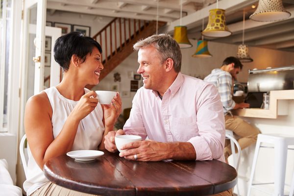 Mature couple having coffee together