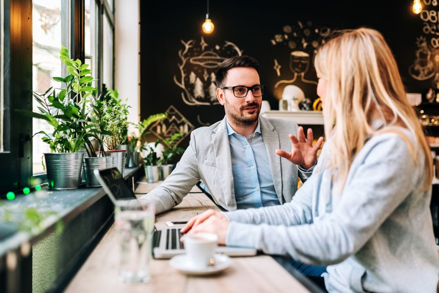 Two business people having conversation on a coffee shop